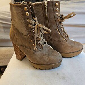 Tan boots with a heel